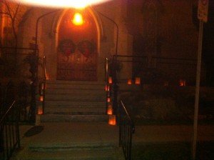 Candles inside bags invite us to midnight mass at St. John, Ancaster
