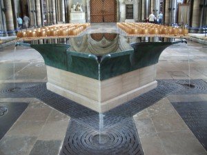 The striking, cross-shaped green marble font of Salisbury Cathedral